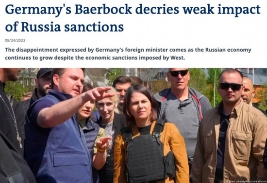 △“德國之聲”網站報道截圖（題圖中間為貝爾伯克）